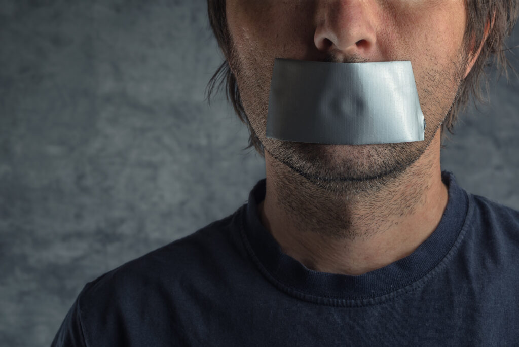 man with mouth taped symbolising censorship